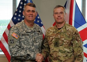 Lt. Gen. David Halverson, deputy commanding general of U.S. Army Training and Doctrine Command, poses for a photo with Maj. Gen. Bruce Brealey, director general for the United Kingdom's Force Development and Training Command, April 30, 2013. Brealey is the UK's equivalent to the director of the Army Capabilities Integration Center, and this was his second visit to TRADOC. In addition to office calls with Halverson and Lt. Gen. Keith Walker, director of ARCIC, Brealey also had in-depth discussions with ARCIC directorate leads about ARCIC's roles and responsibilities in concept development, requirements determination and capability assessment. (U.S.
Army photo by Staff Sgt. Steven Schneider)
