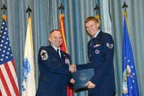 U.S. Air Force personnel at Joint Base San Antonio received their associates, bachelors, and masters degrees May 3, at a ceremony in the Fleenor Auditorium Joint Base San Antonio-Randolph. The Community College of the Air Force provides two year applied science degrees as part Air University's military education system. (U.S. Air Force photo by Benjamin Faske) (released)