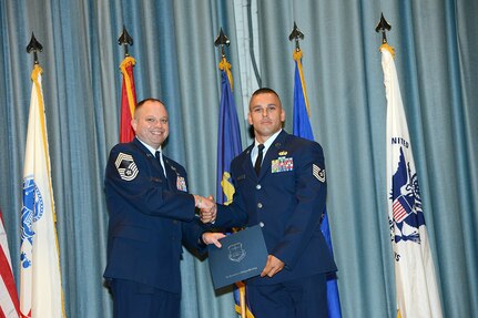 U.S. Air Force personnel at Joint Base San Antonio received their associates, bachelors, and masters degrees May 3, at a ceremony in the Fleenor Auditorium Joint Base San Antonio-Randolph. The Community College of the Air Force provides two year applied science degrees as part Air University's military education system. (U.S. Air Force photo by Benjamin Faske) (released)