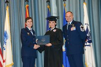 U.S. Air Force personnel at Joint Base San Antonio received their associates, bachelors, and masters degrees May 3, at a ceremony in the Fleenor Auditorium Joint Base San Antonio-Randolph. The Community College of the Air Force provides two year applied science degrees as part Air University's military education system. (U.S. Air Force photo by Benjamin Faske) (released)