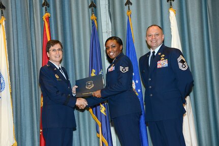 U.S. Air Force personnel at Joint Base San Antonio received their associates, bachelors, and masters degrees May 3, at a ceremony in the Fleenor Auditorium Joint Base San Antonio-Randolph. The Community College of the Air Force provides two year applied science degrees as part Air University's military education system. (U.S. Air Force photo by Benjamin Faske) (released)