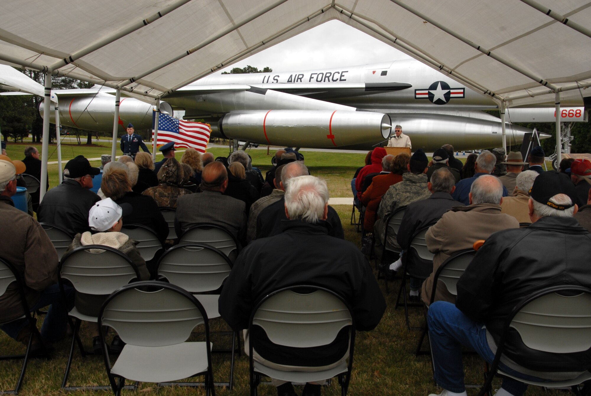 Retired Lt. Col. Raymond McLaughlin, a former B-58 pilot, speaks during the B-58 “Hustler” Dedication Ceremony May 3, 2013, at Little Rock Air Force Base’s Heritage Park. The aircraft was the world’s first supersonic bomber. Little Rock Air Force Base was home to the B-58 mission from 1965 – 1970. (U.S. Air Force photo by Senior Airman Regina Agoha)