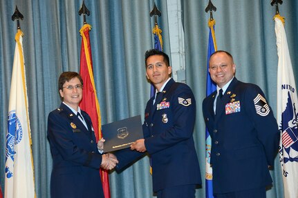 U.S. Air Force personnel at Joint Base San Antonio received their associates, bachelors, and masters degrees May 3, at a ceremony in the Fleenor Auditorium Joint Base San Antonio-Randolph. The Community College of the Air Force provides two year applied science degrees as part Air University's military education system. (U.S. Air Force photo by Benjamin Faske) (released)