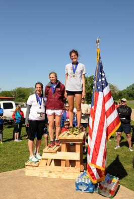 The 1st, 2nd and 3rd place female runners from the Mighty Eighth 8k pose for a photo on Barksdale Air Force Base, La., May 4, 2013. The event commemorated the 71st Anniversary of 8th Air Force. (U.S. Air Force photo/Airman 1st Class Benjamin Gonsier)   