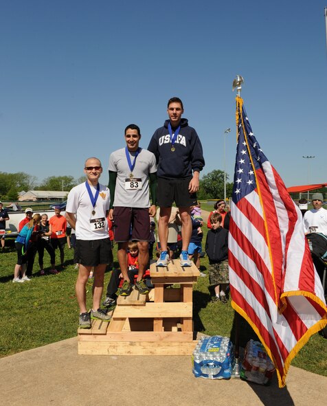 The 1st, 2nd and 3rd place male runners from the Mighty Eighth 8k pose for a photo on Barksdale Air Force Base, La., May 4, 2013. The event commemorated the 71st Anniversary of 8th Air Force. (U.S. Air Force photo/Airman 1st Class Benjamin Gonsier)   