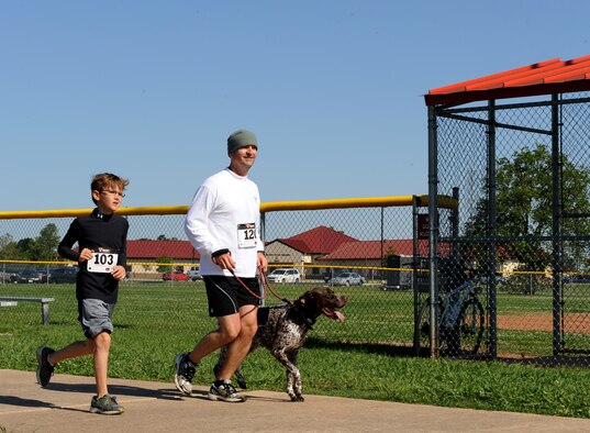 Participants of the Mighty Eighth 8k approach the finish line on Barksdale Air Force Base, La., May 4, 2013. More than 120 base personnel and sponsored guests participated in the event. (U.S. Air Force photo/Airman 1st Class Benjamin Gonsier)