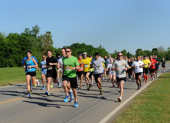 Runners take off at the start of the Mighty Eighth 8k on Barksdale Air Force Base, La., May 4, 2013. More than 120 base personnel and sponsored guests participated in the event. (U.S. Air Force photo/Airman 1st Class Benjamin Gonsier)