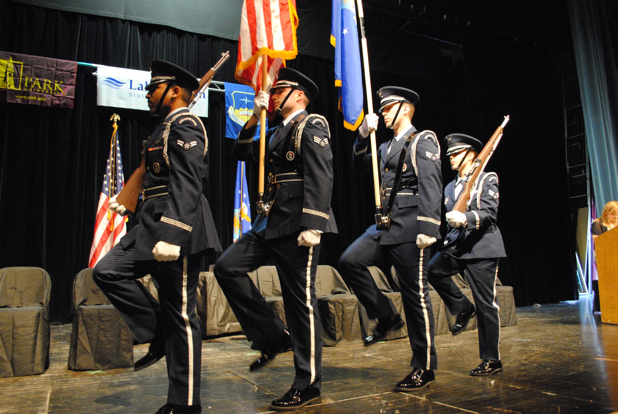 Carrying the U.S. flag, Senior Airman Jeffrey Lowder leads his Honor Guard colors detail through a practice run prior to a combined school graduation ceremony held April 27, 2013, in East Grand Forks, Minn. Lowder said it was an honor to present the colors at his own Community College of the Air Force graduation ceremony. (U.S. Air Force photo/Staff Sgt. Luis Loza Gutierrez)

