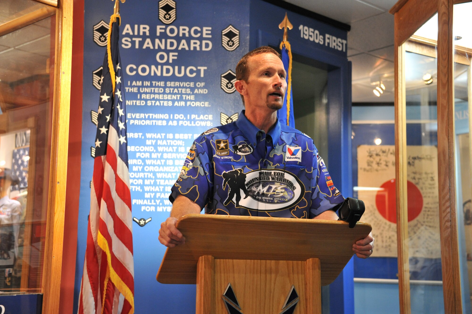 National Hot Rod Association Funny Car champion Jack Beckman speaks about being added to the U.S. Air Force Enlisted Heritage Hall’s Wall of Achievers May 2 at Gunter Annex. Beckman joins a notable list of former enlisted Airmen who have received the honor, including former President George W. Bush, retired Brig. Gen. Chuck Yeager, Johnny Cash and actors Gene Autry and Charlton Heston.  (U.S. Air Force photo by Staff Sgt. Sandi Percival)