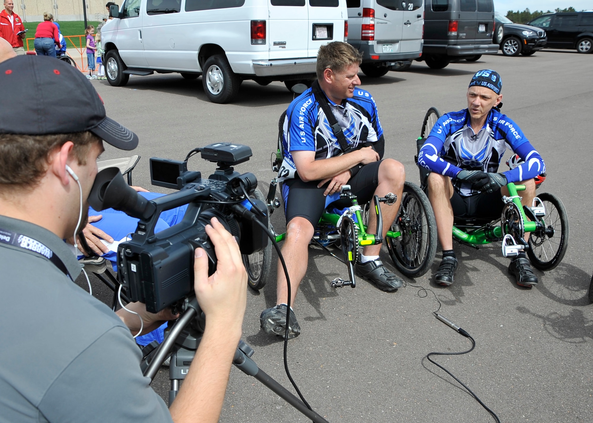 Major Scott Bullis smiles with Senior Master Sergeant Mike Sanders of the
U.S. Air Force.  The two competed in the Men's Recumbent Cycling Race and
crossed the finish line simultaneously for a shared silver medal.  The 2013
Warrior Games will kick off at the U.S. Air Force Academy, May 11 and run
through May 16. The games showcase the resilient spirit of today's wounded,
ill, or injured service members from all branches of the military.  After
overcoming significant injuries, these men and women demonstrate the power
of ability over disability and the spirit of competition. (U.S. Air Force
photo by SSgt Christopher Boitz)
