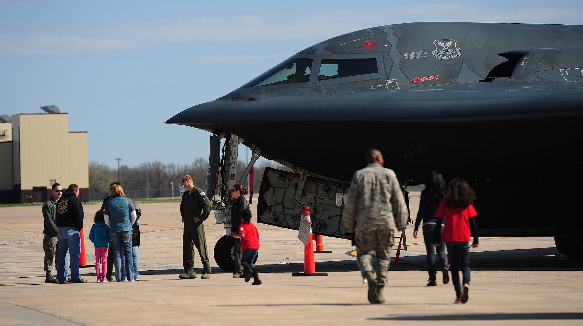Children and their parents view a static display of a B-2 Spirit during Operation Spirit at Whiteman Air Force Base, Mo., April 20, 2013. There were four stations on the flightline with static displays of each aircraft assigned to Whiteman Air Force Base for children to see in person. (U.S. Air Force photo by Staff Sgt. Nick Wilson/Released)