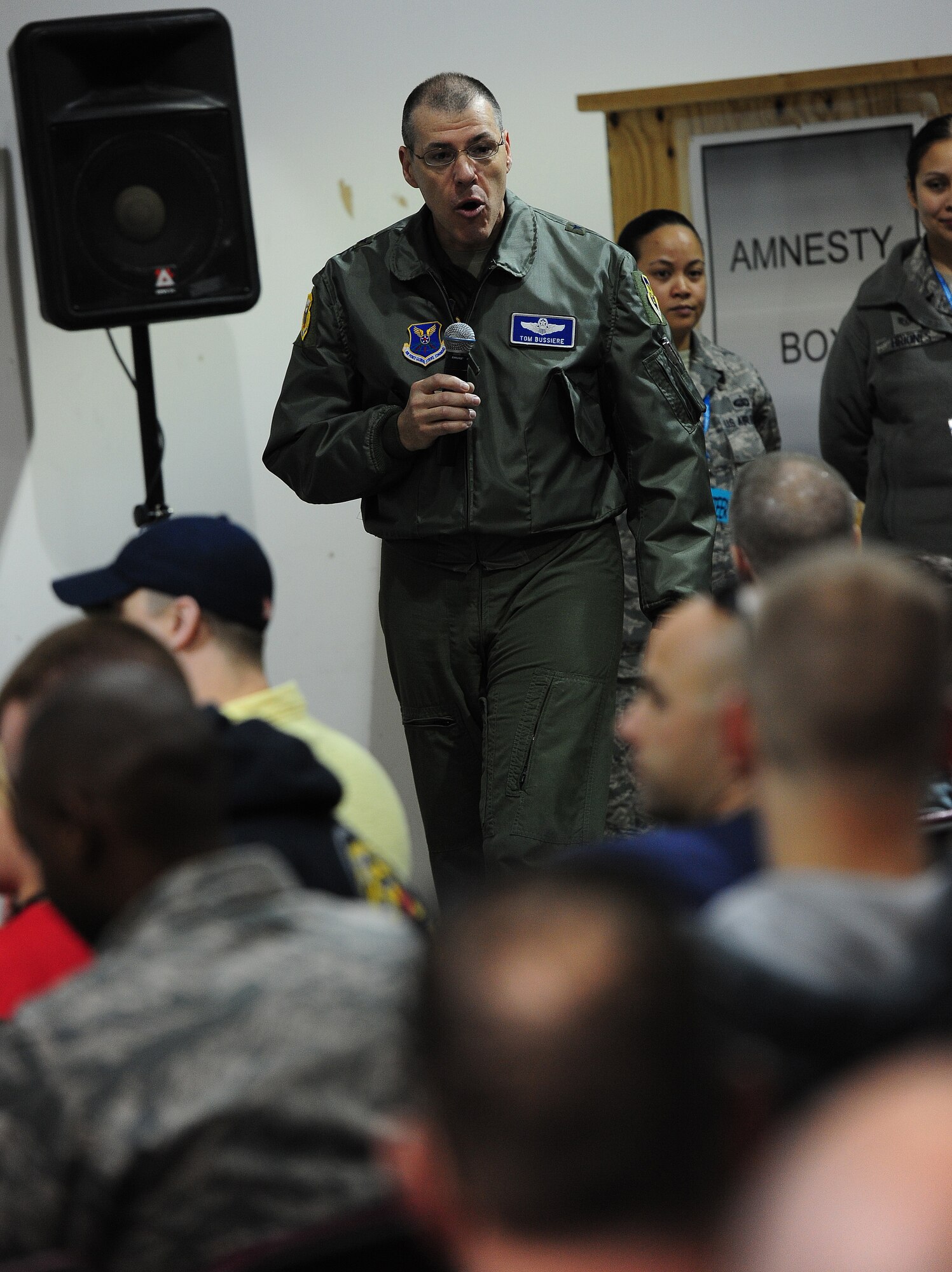 Brig. Gen. Thomas Bussiere, 509th Bomb Wing commander, gives a mission brief to children before they go on a mock deployment to the flightline during Operation Spirit at Whiteman Air Force Base, Mo., April 20, 2013. The event brought the deployment experience to a level children can understand. (U.S. Air Force photo by Staff Sgt. Nick Wilson/Released)