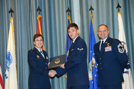U.S. Air Force personnel at Joint Base San Antonio received their associates, bachelors, and masters degrees May 3, at a ceremony in the Fleenor Auditorium Joint Base San Antonio-Randolph. The Community College of the Air Force provides two year applied science degrees as part Air University's military education system. (U.S. Air Force photo by Benjamin Faske) (released)