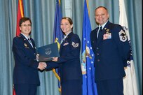 U.S. Air Force personnel at Joint Base San Antonio received their associates, bachelors, and masters degrees May 3, at a ceremony in the Fleenor Auditorium Joint Base San Antonio-Randolph. The Community College of the Air Force provides two year applied science degrees as part Air University's military education system. (U.S. Air Force photo by Benjamin Faske) (released)