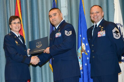 U.S. Air Force personnel at Joint Base San Antonio received their associates, bachelors, and masters degrees May 3, at a ceremony in the Fleenor Auditorium Joint Base San Antonio-Randolph. The Community College of the Air Force provides two year applied science degrees as part Air University's military education system. (U.S. Air Force photo by Benjamin Faske) (released)