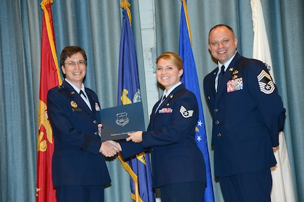 U.S. Air Force personnel at Joint Base San Antonio received their associates, bachelors, and masters degrees May 3, at a ceremony in the Fleenor Auditorium Joint Base San Antonio-Randolph. The Community College of the Air Force provides two year applied science degrees as part Air University's military education system. (U.S. Air Force photo by Benjamin Faske) (released)