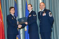 U.S. Air Force personnel at Joint Base San Antonio received their associates, bachelors, and masters degrees May 3, at a ceremony in the Fleenor Auditorium Joint Base San Antonio-Randolph. The Community College of the Air Force provides two year applied science degrees as part Air University's military education system. (U.S. Air Force photo by Benjamin Faske) (released)