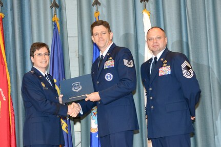 U.S. Air Force personnel at Joint Base San Antonio received their associates, bachelors, and masters degrees May 3, at a ceremony in the Fleenor Auditorium Joint Base San Antonio-Randolph. The Community College of the Air Force provides two year applied science degrees as part Air University's military education system. (U.S. Air Force photo by Benjamin Faske) (released)