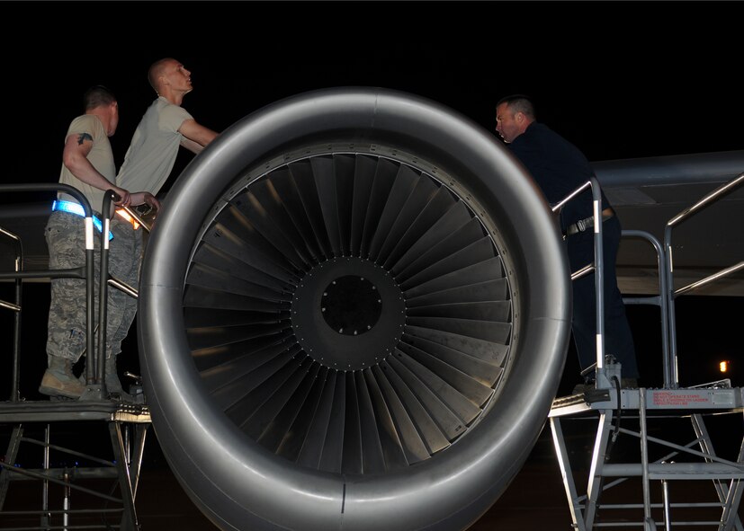 From left, Staff Sgt. Jeffrey Abel and Senior Airmen Joseph Ulicny and Robert Robbins, all with the 100th Maintenance Squadron, prepare the engine cowlings on a KC-135R for removal April 20, 2013, in Southwest Europe. The engine needed to be replaced and sent back to a repair depot at Tinker Air Force Base, Okla., after it was damaged beyond the forward deployed 351st Expeditionary Air Refueling Squadron’s ability to fix it. (U.S. Air Force photo by 1st Lt. Christopher Mesnard/Released)