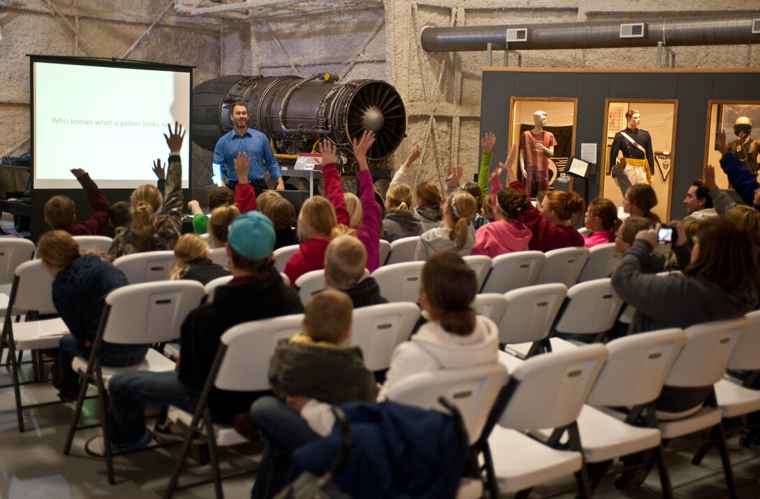 Children from a number of Black Hills area schools learn how to protect their environment from Aaron Fielder, 28th Civil Engineer Squadron Resource Efficiency manager, during an Earth Day presentation at the South Dakota Air and Space Museum in Box Elder, S.D., May 1, 2013. The focus of the event was to increase awareness and support for environmental protection and water conservation. (U.S. Air Force photo by Airman 1st Class Zachary Hada/Released)