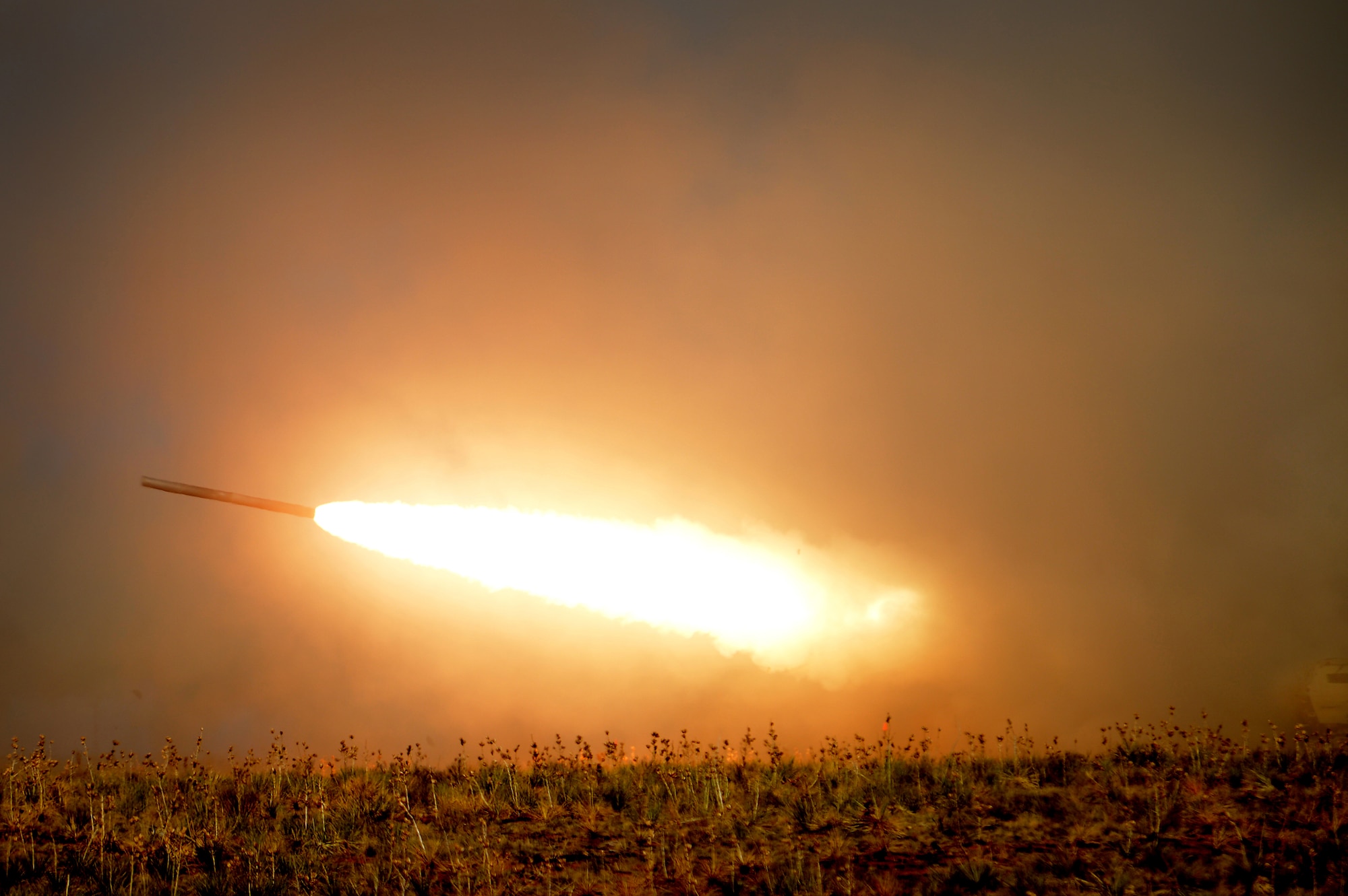 A High Mobility Artillery Rocket System (HIMARS) crew fires a reduced range practice rocket at Melrose Air Force Range N.M. in support of Emerald Warrior April 24, 2013. Emerald Warrior simulated special operations components in urban and irregular warfare settings.The exercise leveraged lessons learned from Operation Iraqi Freedom, Operation Enduring Freedom and other historical events to provide combatant commanders with a better-trained and ready force. (U.S. Air Force photo/ Staff Sgt. Matthew Plew)