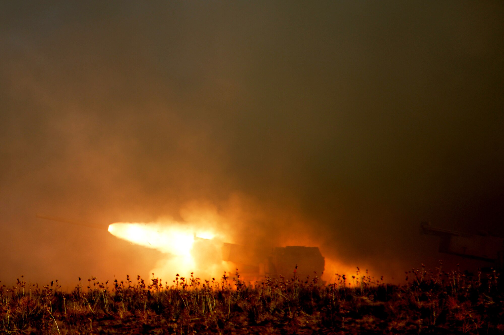 A High Mobility Artillery Rocket System (HIMARS) crew fires a reduced range practice rocket at Melrose Air Force Range N.M. in support of Emerald Warrior April 24, 2013. Emerald Warrior simulated special operations components in urban and irregular warfare settings.The exercise leveraged lessons learned from Operation Iraqi Freedom, Operation Enduring Freedom and other historical events to provide combatant commanders with a better-trained and ready force. (U.S. Air Force photo/ Staff Sgt. Matthew Plew)