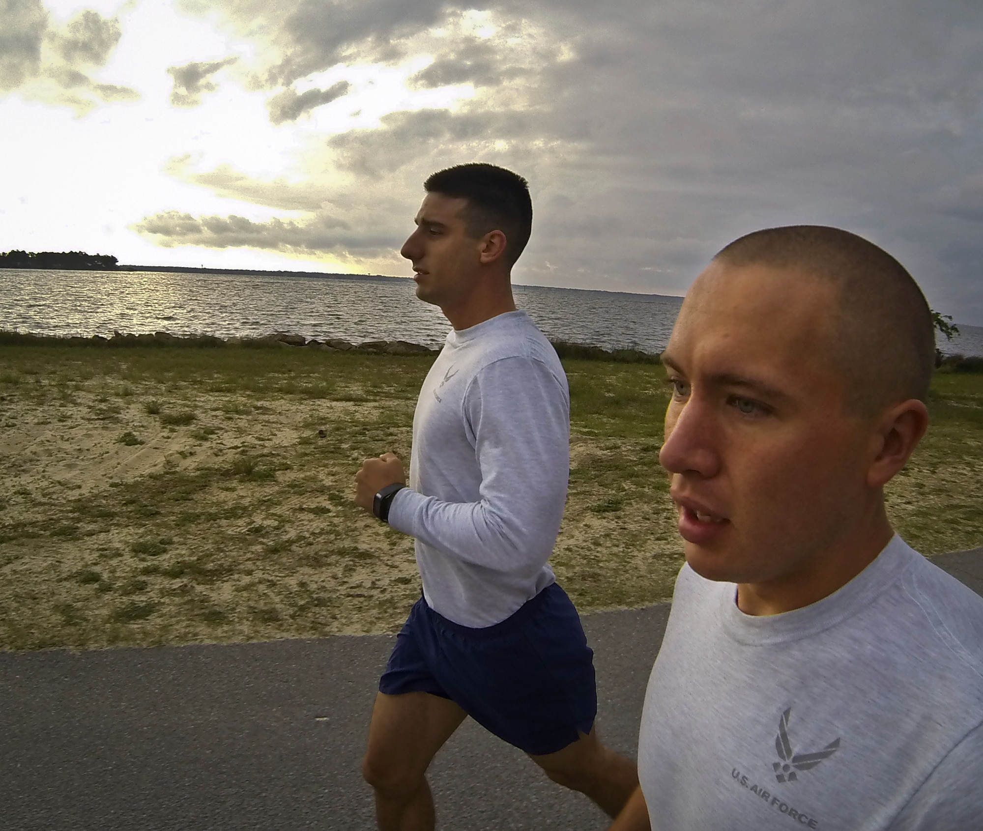 Airman 1st Class Thomas Church and Senior Airman Chris Gauthier, from the 96th Communications Squadron, jog around Post’l Point May 2 at Eglin Air Force Base, Fla.  The two Airmen are ultra-marathoners and just completed a 12-hour, more than 50 mile charity run May 4.  (U.S. Air Force photo/Samuel King Jr.)