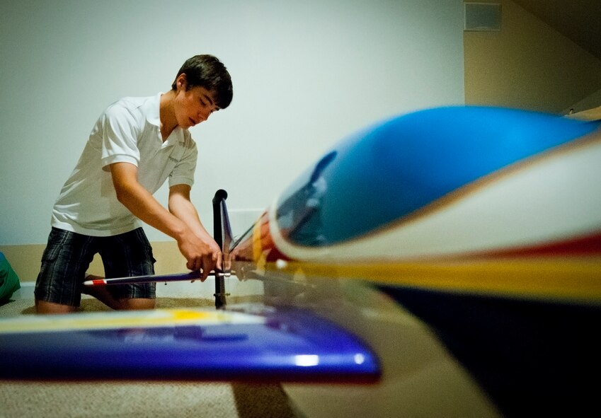 Cody Powell, the 13-year-old son of Maj. Jeff Powell, the 919th Maintenance Operations Flight commander, pieces together his competition-ready radio-controlled aircraft in his home May 1.  Cody has won all but one of his 15 RC aircraft competitions since he and his father joined the hobby two years ago.  (U.S. Air Force photo/Tech. Sgt. Samuel King Jr.)