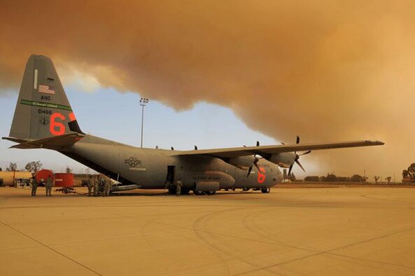 A C-130J from the California Air National Guard’s 146th Airlift Wing is prepared for possible use against wildfires. The aircraft from the California Air National Guard is equipped with the Modular Airborne Fire Fighting Systems, or MAFFS, and can drop up to 3,000 gallons of fire retardant. (Courtesy photo) 
