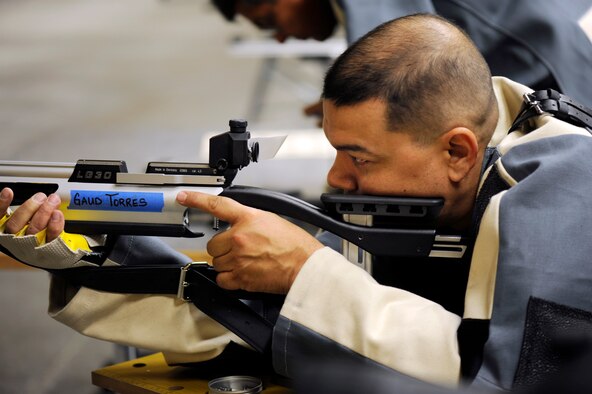 Axel inspects his target during the Wounded Warrior Games training camp held in Colorado Springs, Colo., Apr. 16, 2013. (Photo/Desiree Palacios)