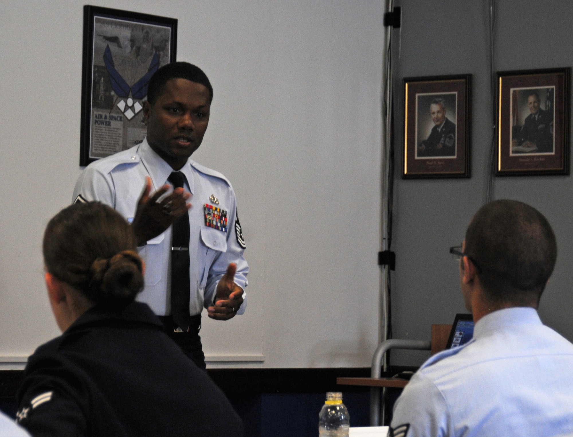 Master Sgt. Jonathan Saunders, 31st Force Support Squadron career assistance advisor and First Term Airmen Center NCO in charge, briefs first term Airmen April 29, 2013, at Aviano Air Base, Italy. FTAC helps prepare first term Airmen to transition from technical training to the operational aspect of the Air Force. (U.S. Air Force photo/Airman Ryan Conroy)