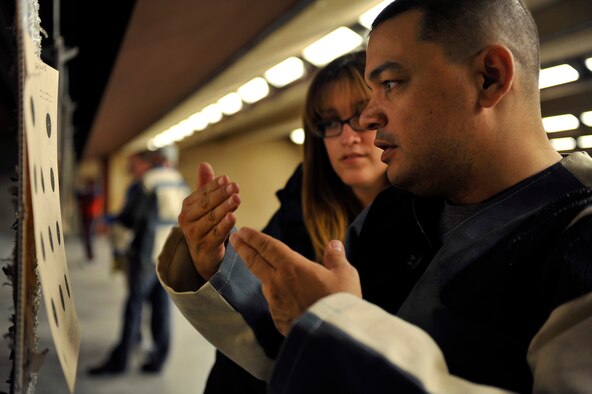 Axel and his wife Alexandra discuss his aim precision before taking down his target during the Warrior Games training camp held in Colorado Springs, Colo., Apr. 16, 2013. (Photo by Desiree Palacios)