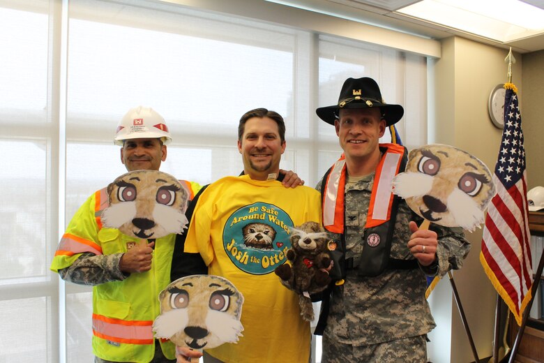 Omaha District Deputy Commander, Lt. Col. Mark Martinez; Safety Specialist, Jeff Skrivanek; and District Commander, Col. Joel Cross, emphasize workplace, construction and water safety while "Otter spotting" for the Josh the Otter Water Safety program. 