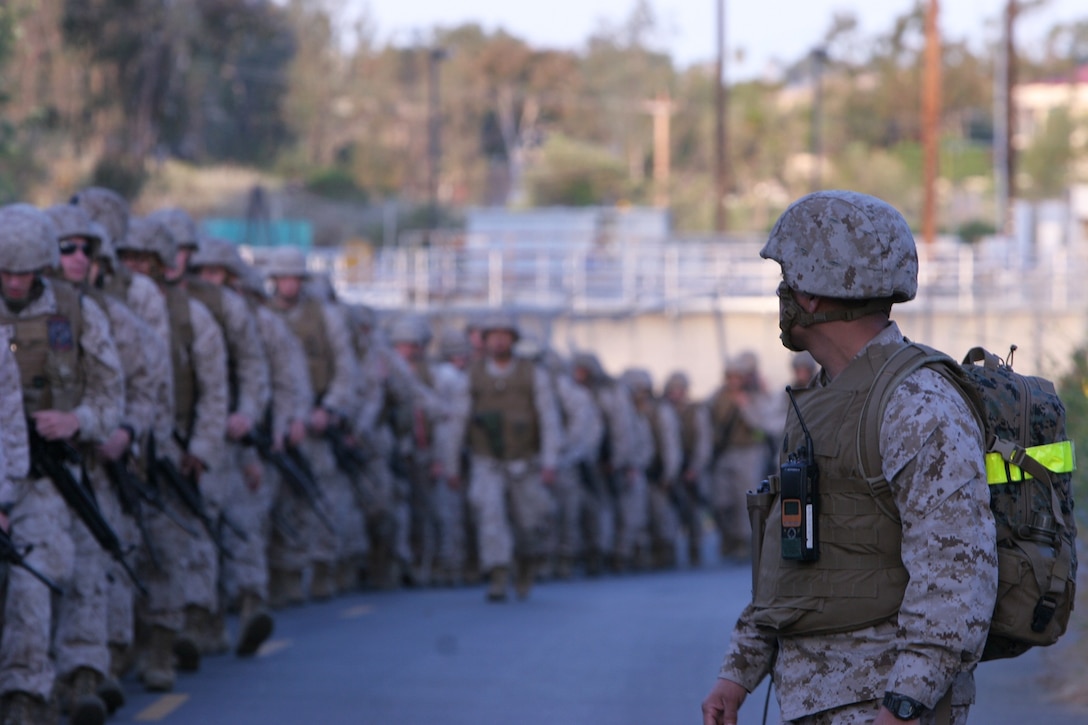 Marines and sailors with Headquarters Company, Combat Logistics Regiment 17, 1st Marine Logistics Group, conduct a conditioning hike aboard Camp Pendleton, Calif., May 3, 2013.