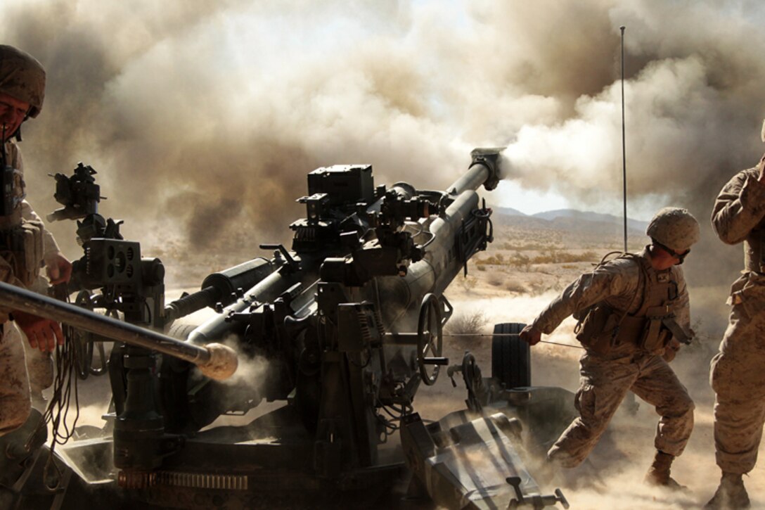 Marines with Battery N, 5th Battalion, 14th Marine Regiment, fire an M777 A2 howitzer during a series of integrated firing exercises at the Combat Center’s Quakenbush Training Area April 26, 2013. (Official USMC photo by Cpl. William J. Jackson/Released)