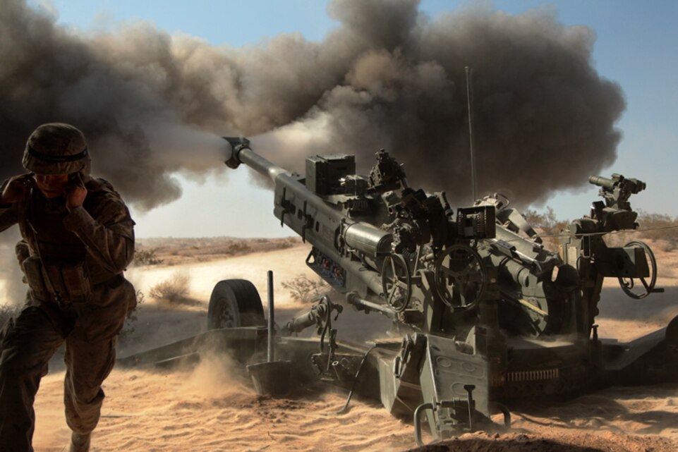 Marines with Battery N, 5th Battalion, 14th Marine Regiment, fire an M777 A2 howitzer during a series of integrated firing exercises at the Combat Center’s Quakenbush Training Area April 26, 2013. (Official USMC photo by Cpl William J. Jackson/Released)