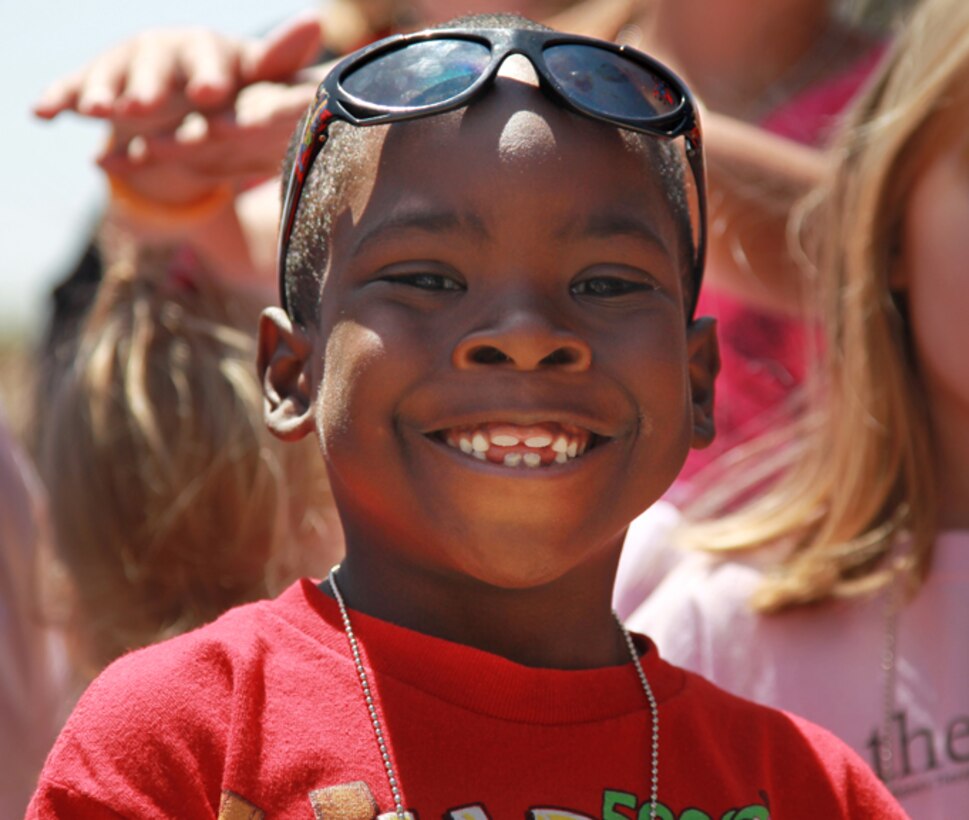 Jayson Mike, 6, son of Sgt. Justin Mike, Unmanned Aerial Vehicle Squadron 3, waits to see a static display of an M1A1 Abrams main battle tank during the L.I.N.K.S CAX for Kids program April 25, 2013. (Official USMC photo by Cpl. William J. Jackson/Released)