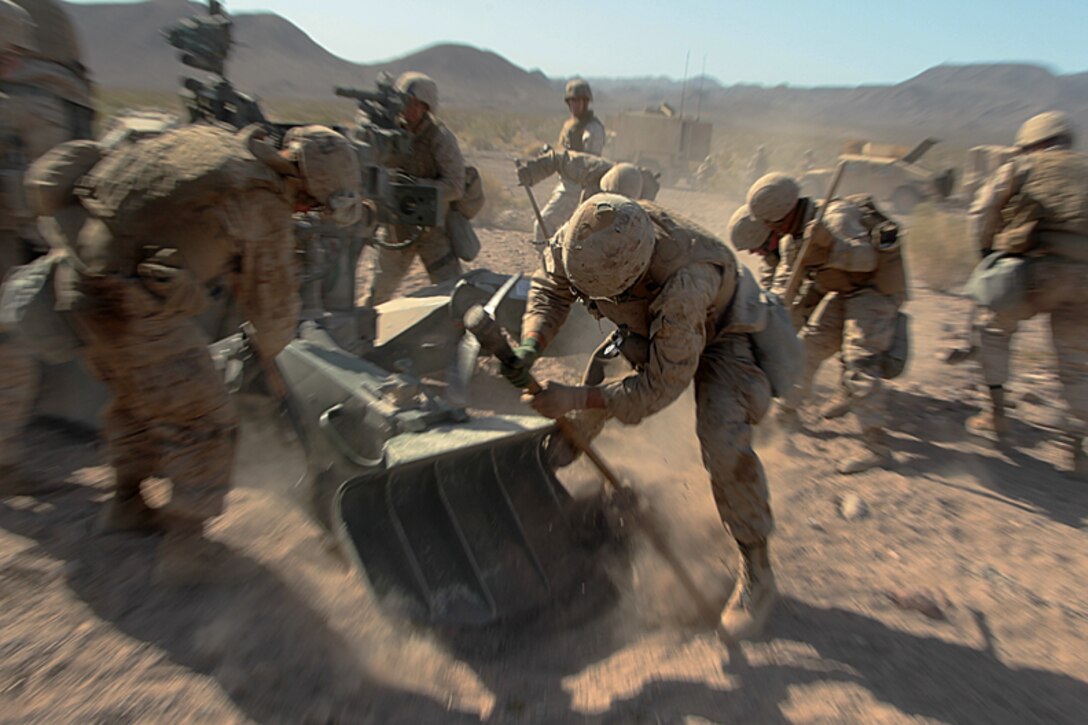 Marines with Battery C, 1/11,  emplace their weapon in the Rainbow Training Area, as part of 11th Regiment’s artillery competition. The battalion faced off against 2nd and 3rd Battalion as well as Battery I, 3rd Battalion, 12th Marine Regiment. The winner of the competition will be announced after the completion of Desert Scimitar, May 5, 2013