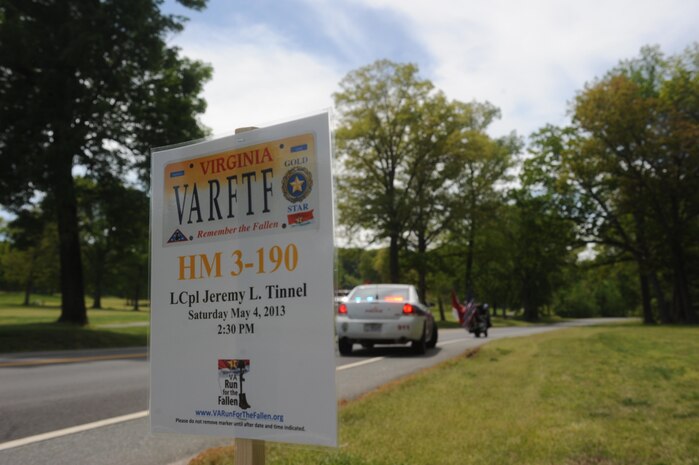 A Virginia Run for the Fallen hero marker stands alongside Fuller Rd., aboard Marine Corps Base Quantico on May 4, 2013. A motorcade consisting of recreational vehicles, motorcycles, the base Provost Marshal’s Office and the County Sheriff’s Department escorted 18 runners through the base.