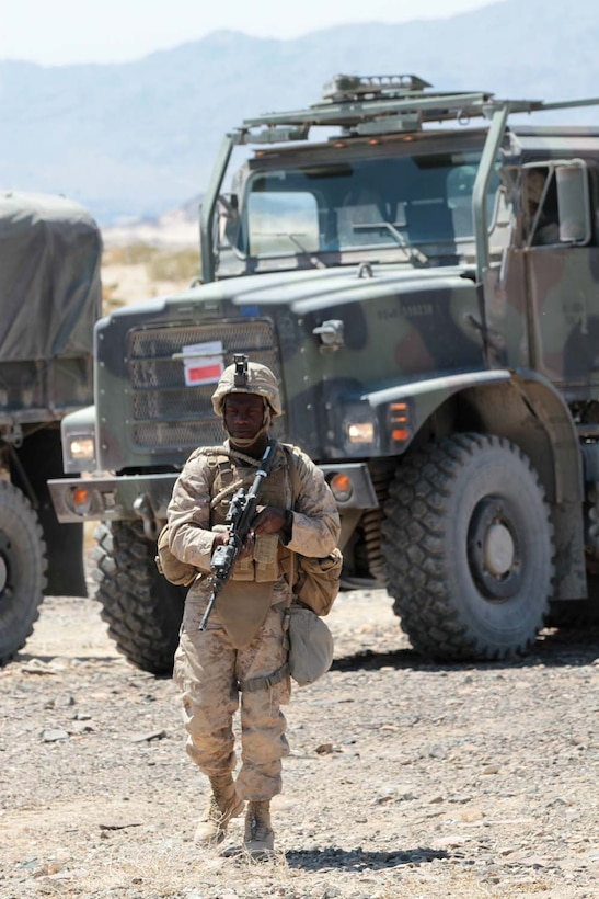 Lance Cpl. Tevin M. Moore, a motor transport mechanic with Truck Company Alpha, Headquarters Battalion, 1st Marine Division, provides security for a route clearance team here, May 3, 2013. Moore, a 21-year-old native of Shannon, Miss., provided overwatch while his lead man scanned the area for simulated improvised explosive devices. (U.S. Marine Corps photo by Sgt. Jacob H. Harrer)