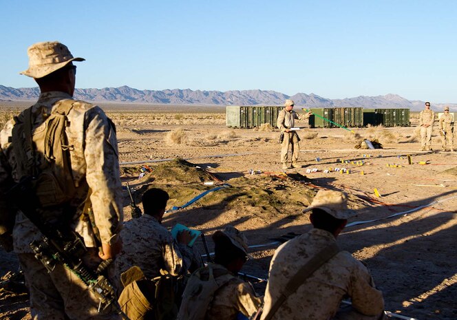 Marines serving with 5th Marine Regiment, 1st Marine Division, conduct a rehearsal of concept drill during Exercise Desert Scimitar here, May 2, 2013. Desert Scimitar is a combined arms exercise focused on the training and preparation of 1st Marine Division for deployment as the ground combat element of a Marine Air-Ground Task Force. The headquarters element of the "Fighting Fifth" exercised traditional warfare command and control tactics over infantrymen serving with 2nd Battalion, 5th Marines, and 1st Bn., 7th Marines; artillery with 2nd Bn., 11th Marines; armored assets of 1st Tank Bn.; and 3rd Light Armored Reconnaissance Bn. during Desert Scimitar.