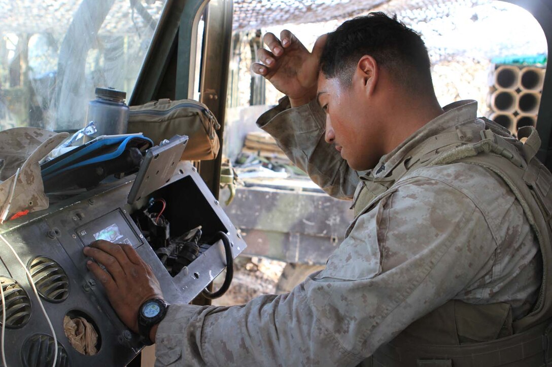 Corporal Diego Castaneda, a motor transportation maintenance chief serving with Golf Battery, 2nd Battalion, 11th Marine Regiment, works on the onboard diagnostics of a 7-ton truck during Exercise Desert Scimitar, a combined-arms, live-fire training exercise here, May 3, 2013. Castaneda, a native of Gibbon, Neb., is the only mechanic in the battery and is in charge of keeping more than 40 vehicles properly maintained and running. Captain William Turner, the commanding officer of Golf Battery, said thanks to Castaneda's devotion and hard work, the battery is one of the few in 11th Marines that can commute to and from the Combat Center without vehicles breaking down.