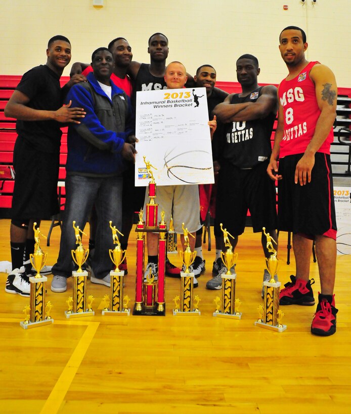 Marine Embassy Security Group's Intramural basketball team, the Go Gettas, pose with the 2013 championship trophy at Barber Physical Activity Center on May 6, 2013, after defeating  Marine Corps Systems Command, 56 - 38. The Go Gettas finished last year with a perfect 0 - 16 record.