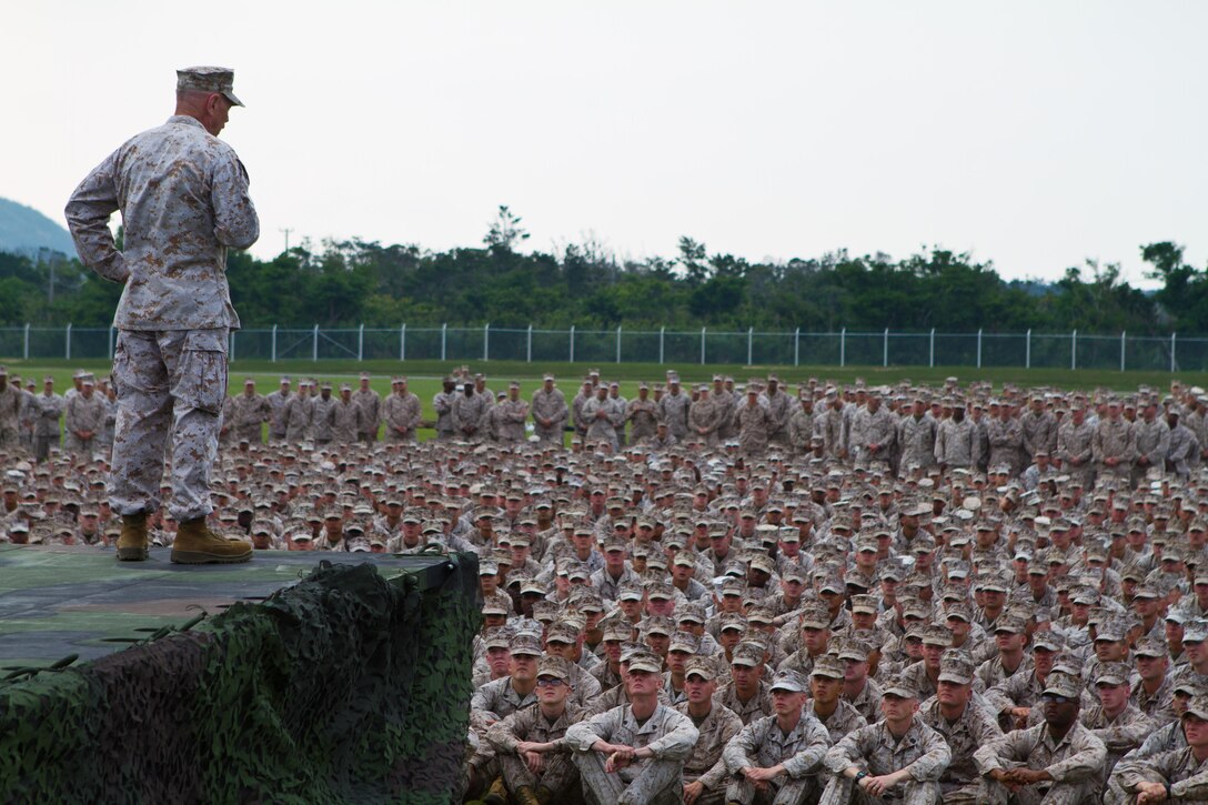 Lieutenant Gen. Kenneth J. Glueck Jr., commanding general of III Marine Expeditionary Force, speaks with Marines and Sailors of the 31st Marine Expeditionary Unit and other various units based on Camp Hansen, May 7. Glueck, along with Sgt. Maj. Steven Morefield and Master Chief Petty Officer Leon Vorters Jr., sergeant major and command master chief for III MEF, addressed the crowd on the “fight tonight” readiness concept for immediate deployment of response units, force preservation within the ranks and the reconstitution of III MEF assets for future operations and exercises. The 31st MEU is the only continuously forward-deployed MEU and is the Marine Corps’ force in readiness in the Asia-Pacific region.