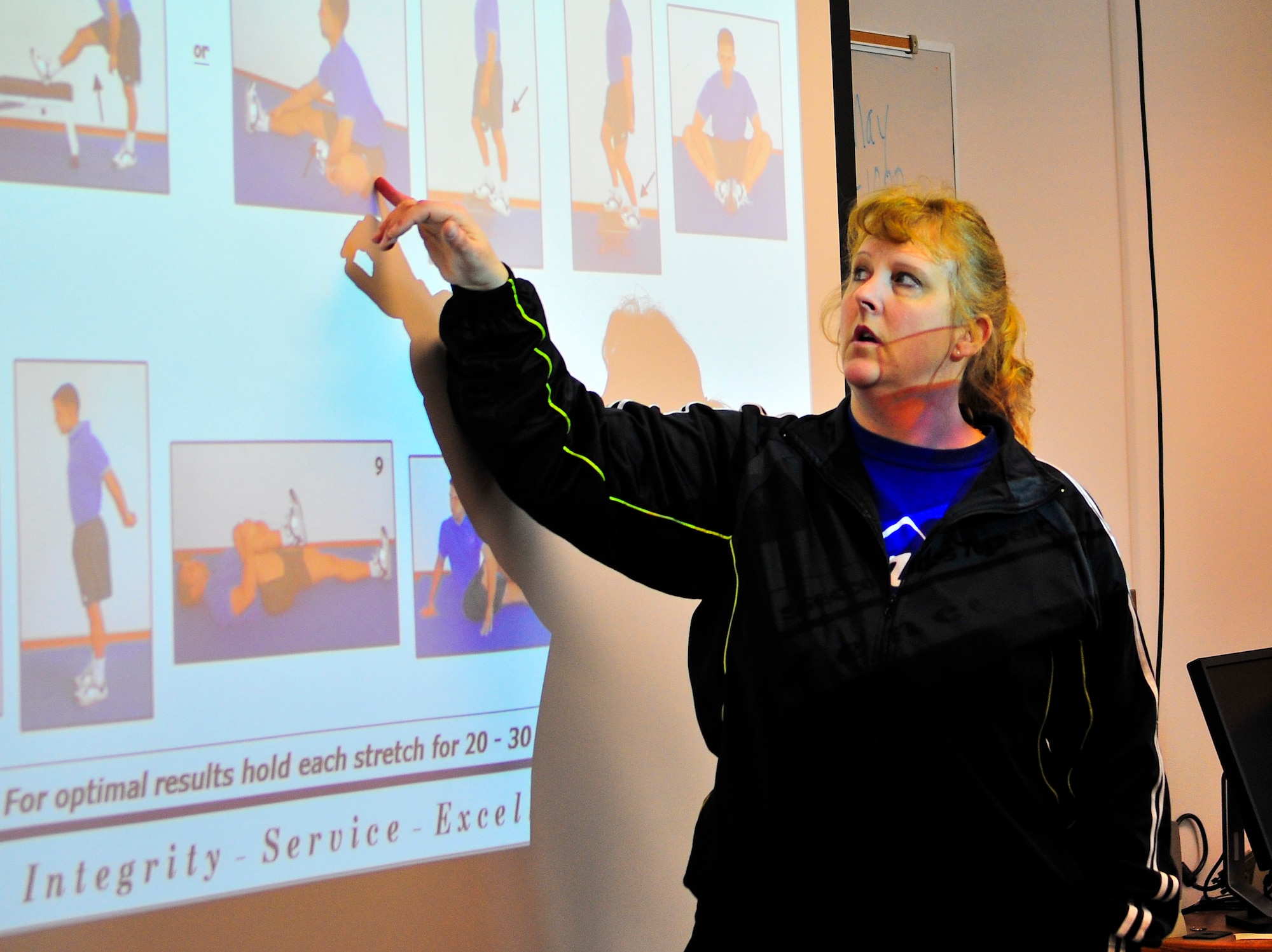 Dana Baugh, 354th Medical Operations Squadron exercise physiologist, teaches proper stretching techniques during a physical training leader class at the Health and Wellness Center May 7, 2013, Eielson Air Force Base, Alaska. The HAWC provides education and services to improve community awareness and promote healthy lifestyle choices. (U.S. Air Force photo by Racheal E. Watson/Released)