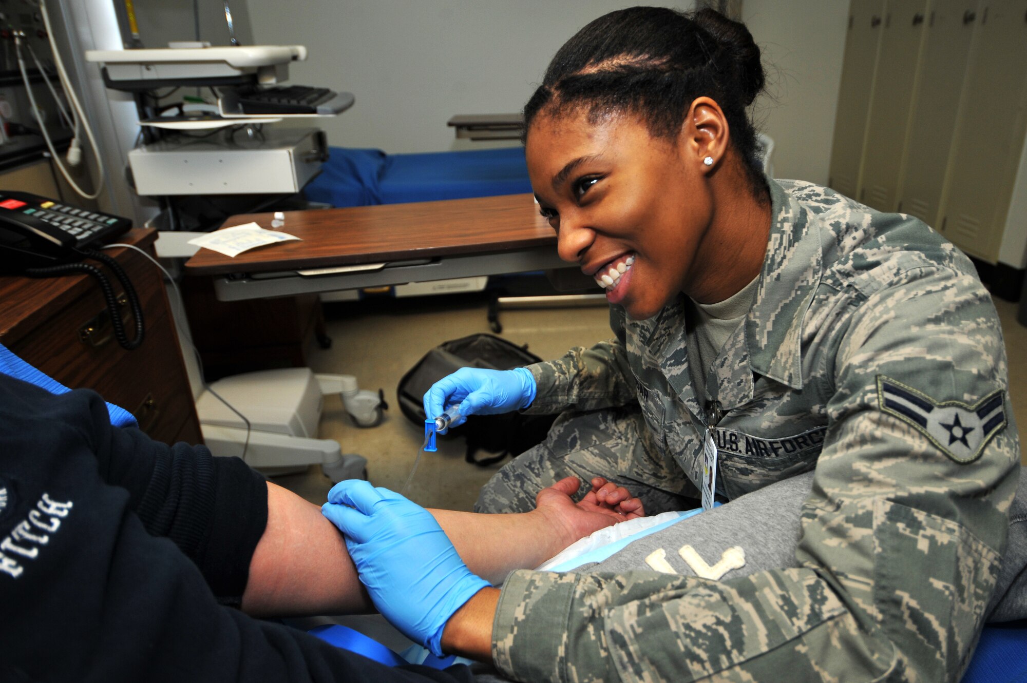 Airman 1st Class Emoni Dunbar, 51st Medical Operations Squadron aerospace medical technician, works in the multiservice inpatient flight at Osan Air Base, Republic of Korea, April 26, 2013. Dunbar is this week’s Airman Spotlight winner. (U.S. Air Force photo/Staff Sgt. Emerson Nuñez)