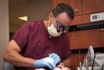 Capt. Jeffrey Welch, 47th Medical Operations Squadron general dentist, inspects a patient’s teeth at Laughlin Air Force Base, Texas, May 6, 2013. The dental clinic on base kept Laughlin’s dental readiness at 99.3 percent throughout the first quarter of fiscal 2013, the highest in the Air Force. (U. S. Air Force photo/Airman 1st Class John D. Partlow)