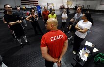 U.S. Air Force Master Sgt. David LeClaire, U.S. Strategic Command, stands in front of one of his Tactical Fitness classes as he waits to be awarded the Air Force Achievement Medal for his role in establishing the TacFit program on Offutt Air Force Base, Neb., April 26. The program offers 13 free classes a week to civilians and military members of Team Offutt. (U.S. Air Force Photo by Josh Plueger/Released)