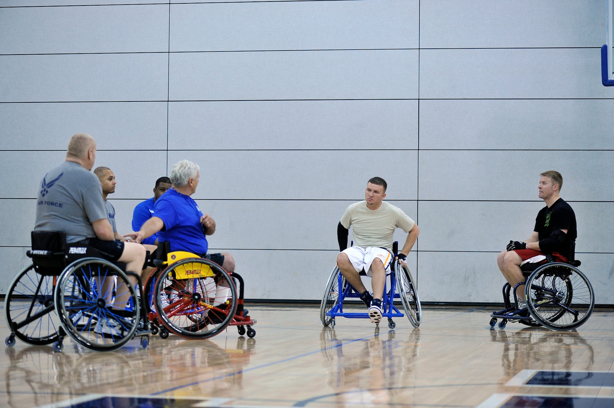 Retired Staff Sgt. Larry Franklin listens to his basketball team member discuss their strategy during the Warrior Games training camp held in Colorado Springs, Colo., April 18, 2013. Franklin resides in Radcliff, Ky. (DoD photo by Desiree Palacios)