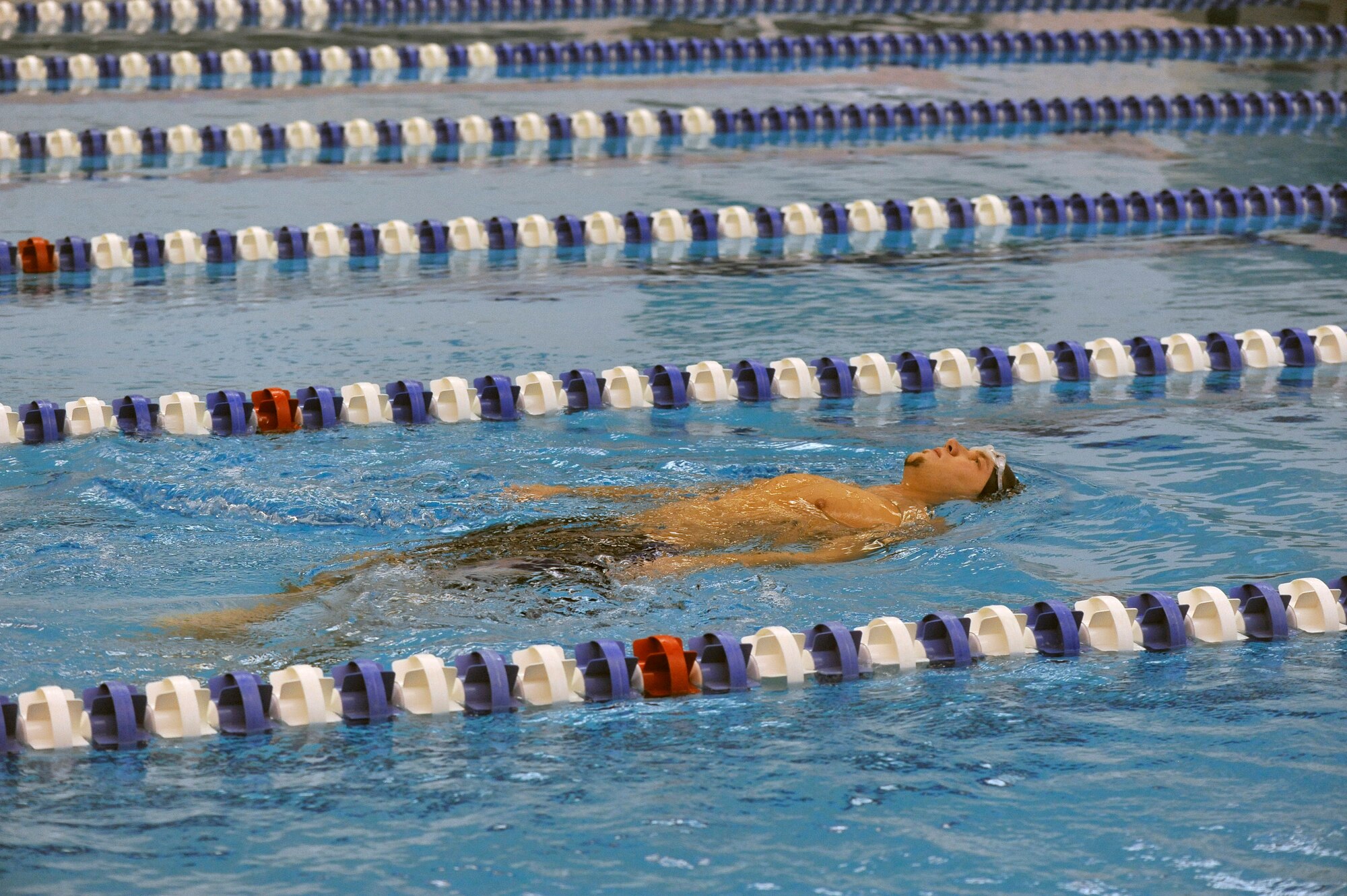 Retired Staff Sgt. Larry Franklin floats on his back at the Academy indoor swimming pool during the Warrior Games training camp held in Colorado Springs, Colo., April 18, 2013. Franklin resides in Radcliff, Ky. (DoD photo by Desiree Palacios)